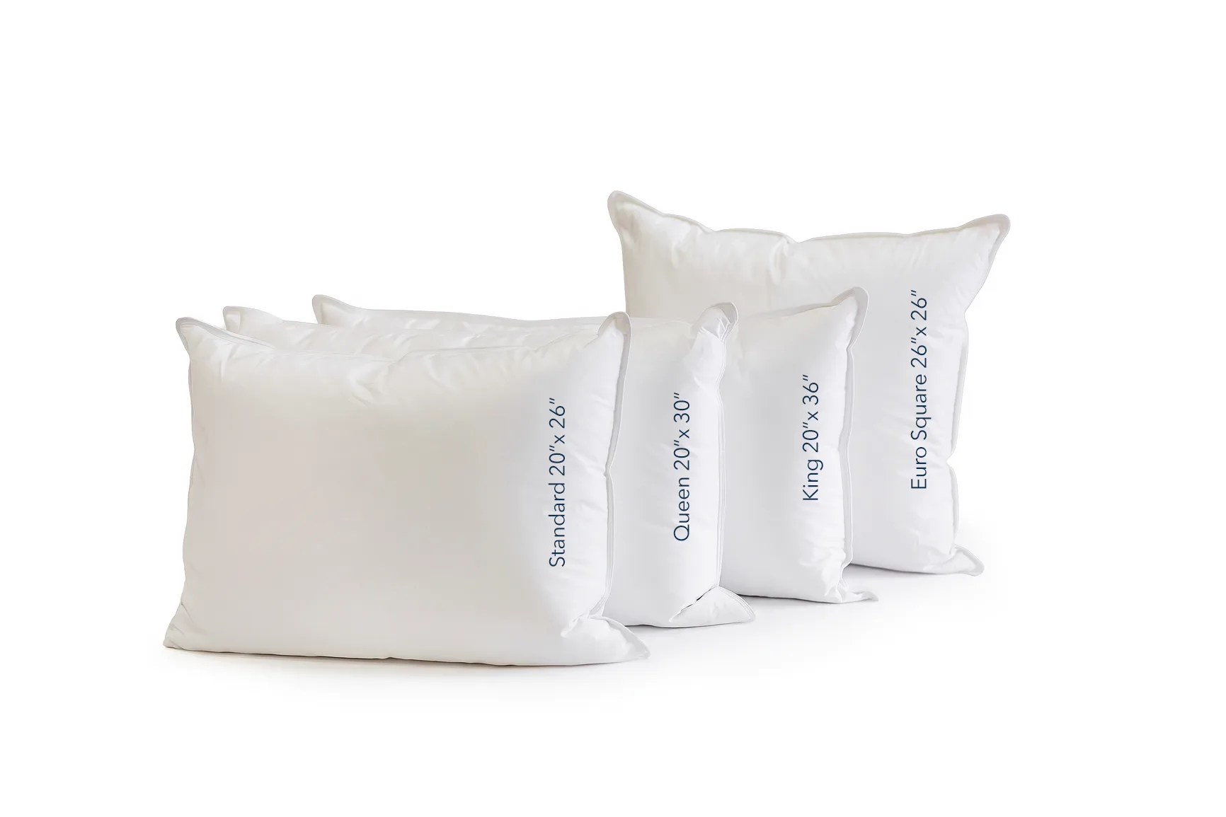 Stack of white pillows with printed size labels: Standard 20" x 26", Queen 20" x 30", King 20" x 36", Euro Square 26" x 26".