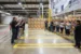 Down Inc. staff and employees awaiting gathered for ribbon cutting ceremony at new facility