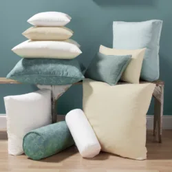 decorative pillows stacked and placed next to each other