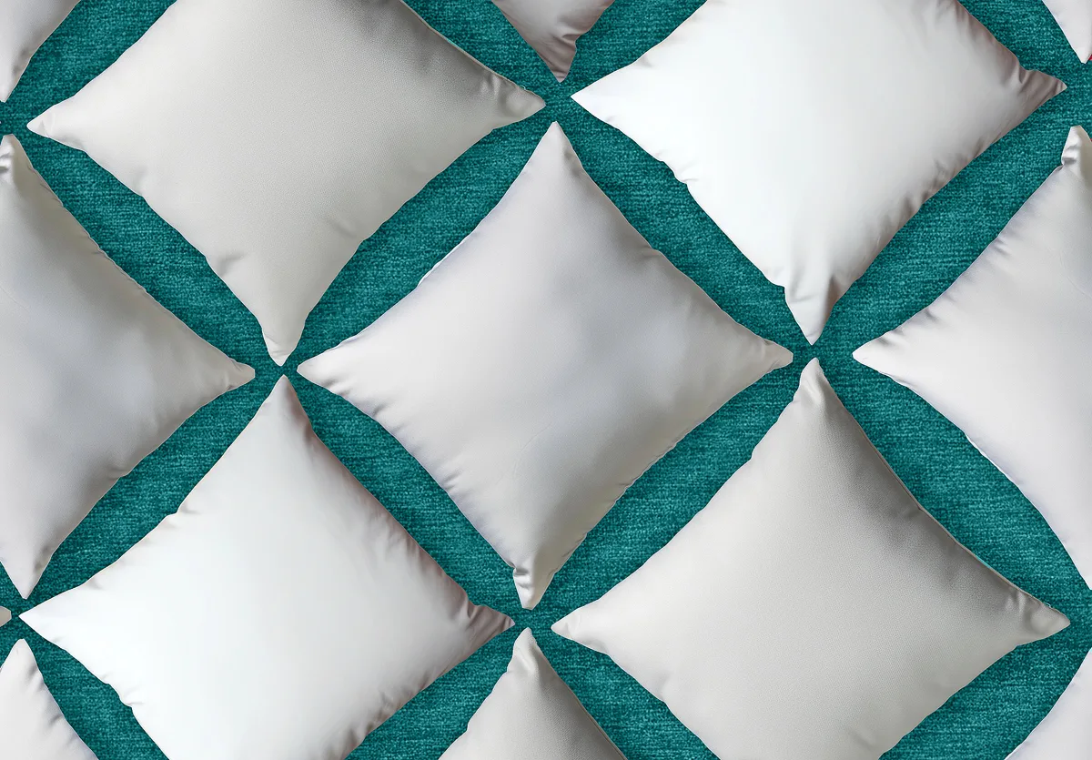 deco pillows decorative pillows layered in a pattern on a teal colored sheet