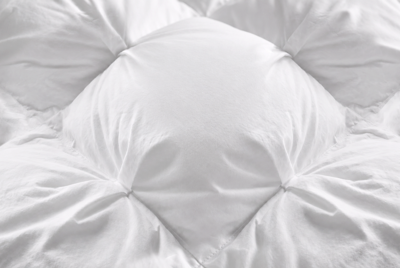 Close-up of the Aria Collection pinch-pleated comforter