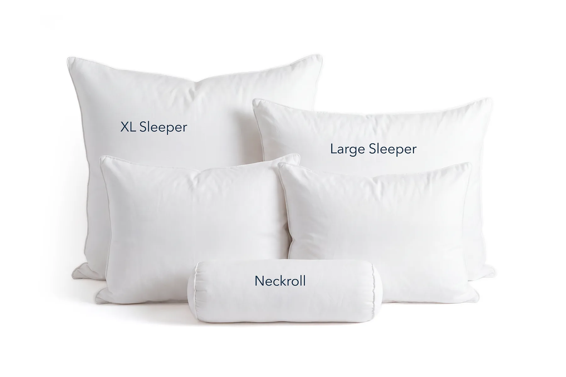 White pillows arranged with a cylindrical neckroll in front; labels read 'XL Sleeper', 'Large Sleeper', and 'Neckroll' on the pillows, indicating pillow sizes.